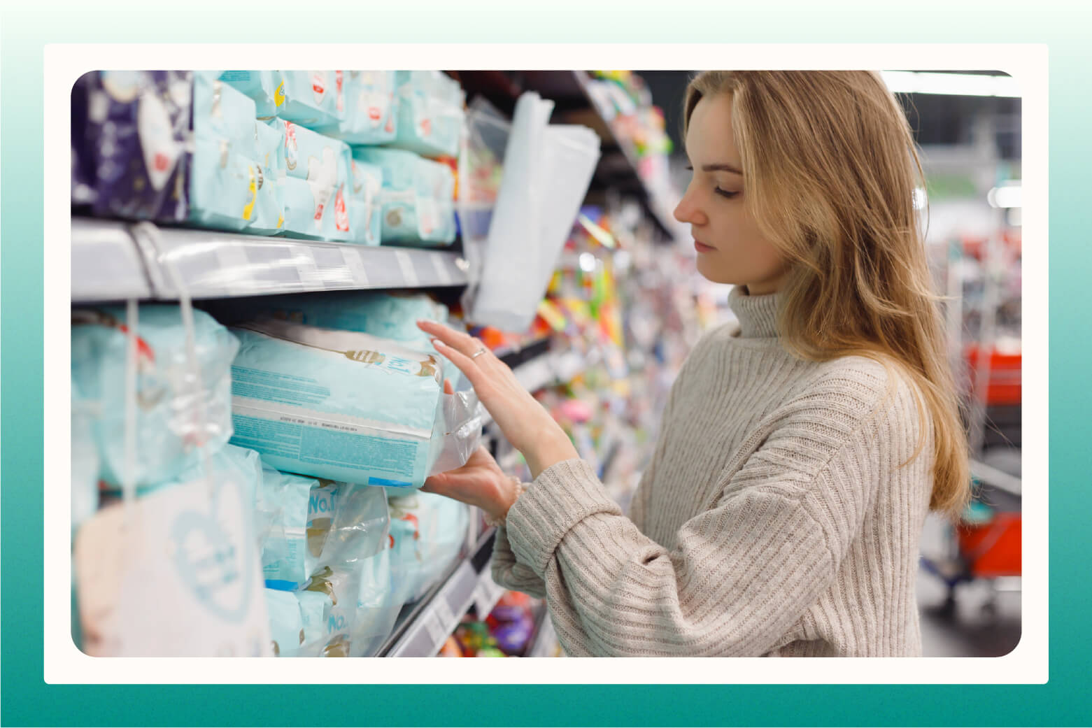 woman looking at a package of diapers from a packed store shelf