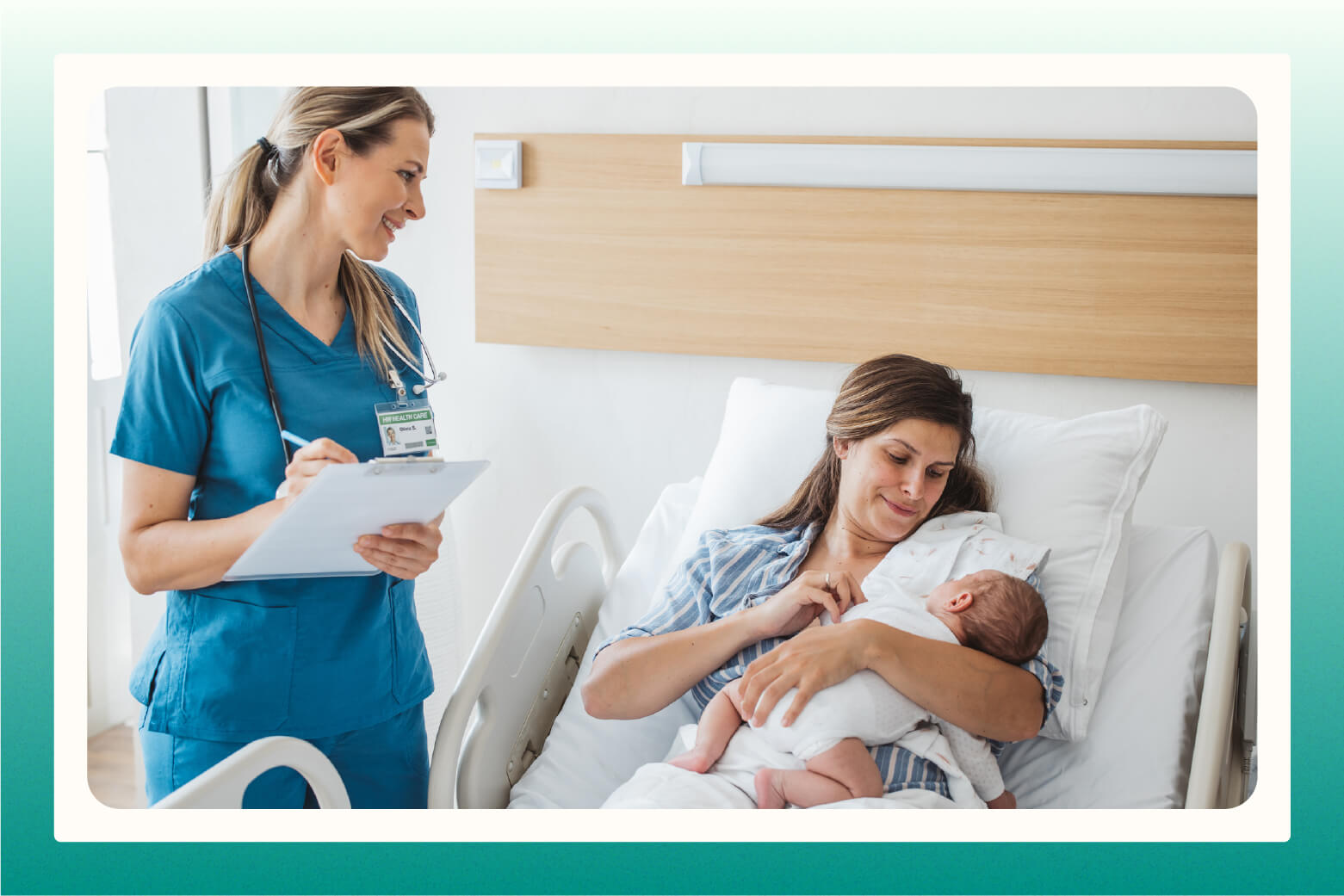 Nurse looking at new mom in hospital bed cradling newborn baby in her arms