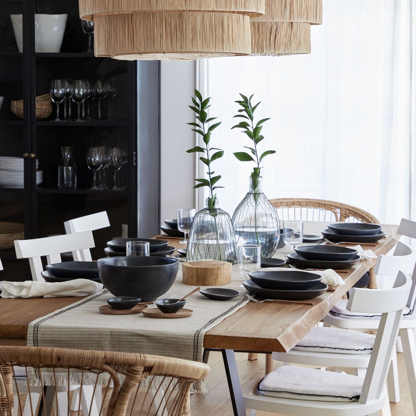 Costa Nova Livia stoneware collection shown on a rustic wood table with matching dinnerware